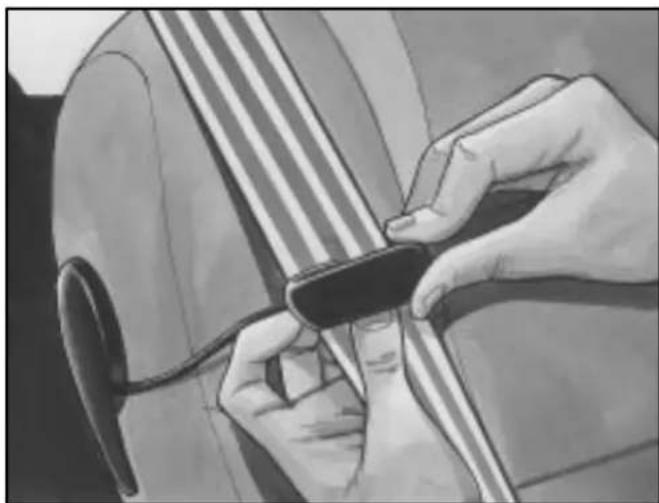Close-up of hands adjusting a black object on a striped surface (no text or symbols visible)