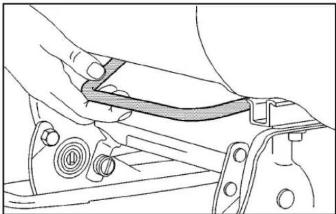 Technical line drawing of a mechanical assembly with a hand adjusting a component (no text or symbols)