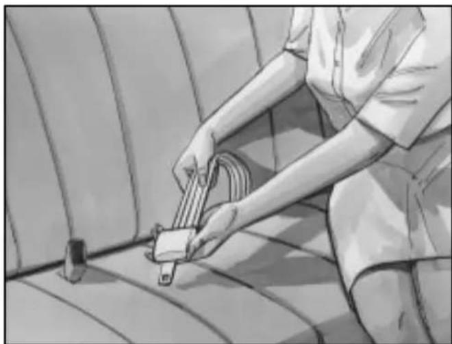 Illustration of a person using a cable to install a component on a vehicle (no text or symbols visible)