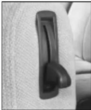 Close-up of a black plastic door clip attached to a textured surface (no visible text or symbols)
