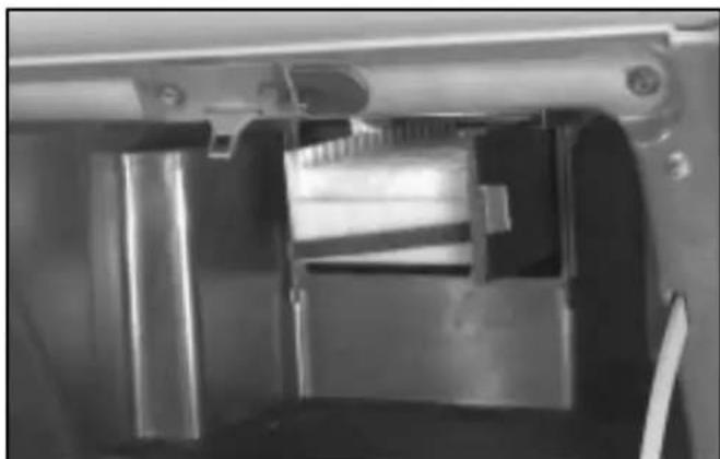 Close-up of a mechanical device interior showing internal components and structural elements (no visible text or symbols)