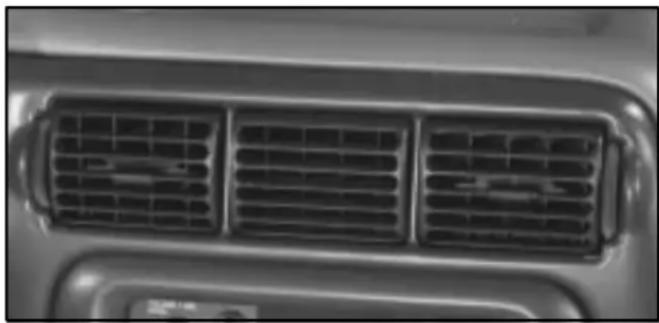 Close-up of a car's front grille with three grilles (no visible text or symbols)