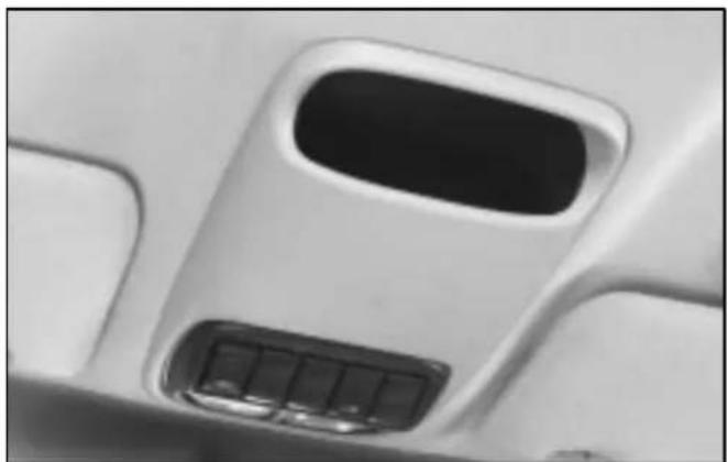 Close-up of a white airplane seat cover with a black vent and control panel (no text or symbols visible)