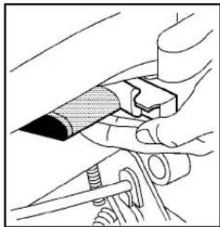 Illustration of hands using a tool to adjust or install a mechanical component (no text or symbols visible)