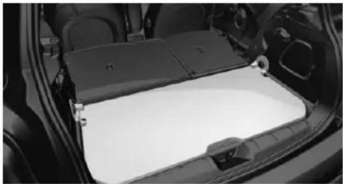 Interior view of a car showing the backrest panel and side compartments (no text or symbols visible)