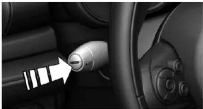 Interior view of a car showing a directional knob and wheel (no text or symbols visible)