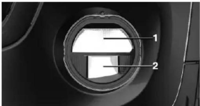 Close-up of a car wheel or engine component with labeled parts (1 and 2), showing internal structure without any text or symbols beyond labels.