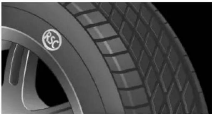 Close-up of a car tire with a circular logo on the wheel (no visible text or symbols)