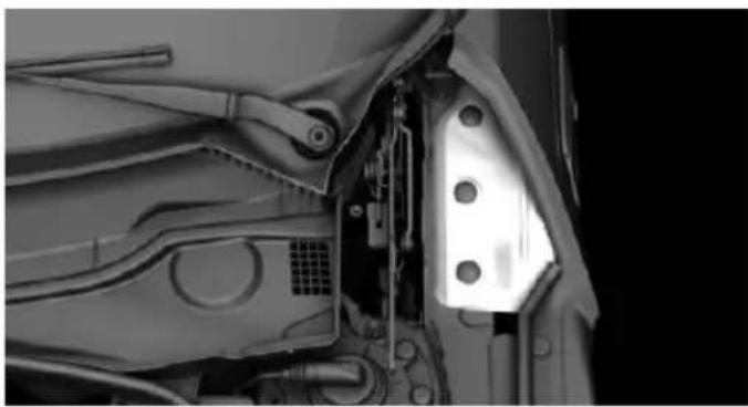 Close-up of a mechanical component with visible parts and mounting holes (no text or symbols)