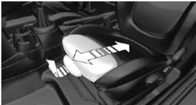 Close-up of a car's engine compartment showing a belt buckle and valve mechanism (no text or symbols visible)