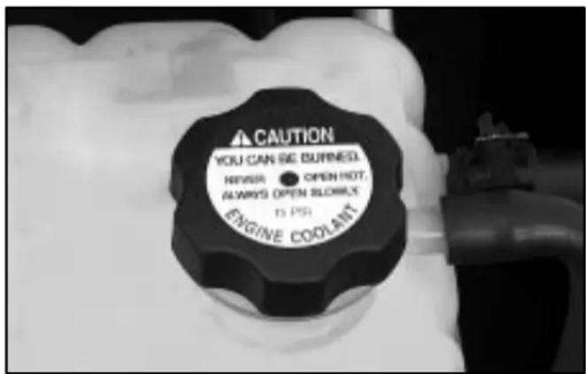 CAUTION YOU CAN BE BURNEST. NEVER • OPEN HOT, ALWAYS OPEN BURNEST ENGINE COOLANT 10 PSI