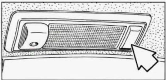 Line drawing of a car interior panel with a mesh grille and a cursor arrow pointing to the side (no text or symbols)