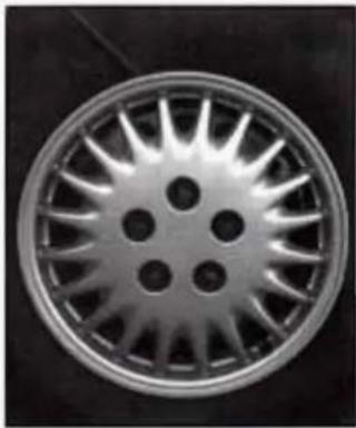 Close-up of a car wheel rim with spoked blades (no text or symbols visible)