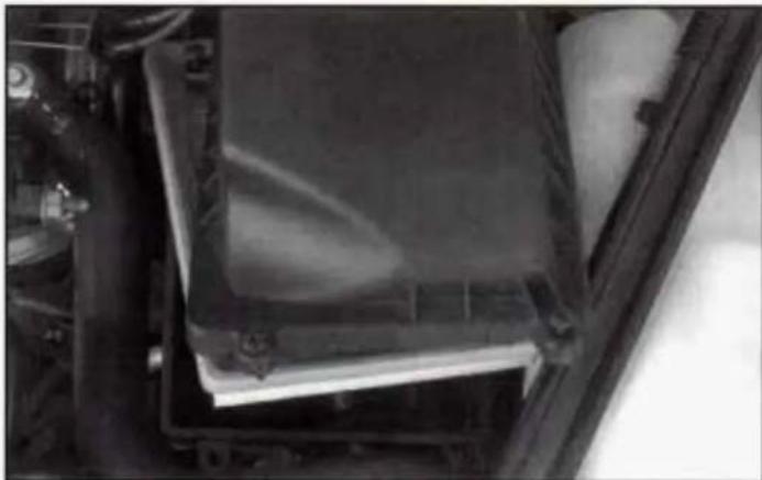 Close-up of a mechanical component with transparent surfaces and mounting brackets (no visible text or symbols)