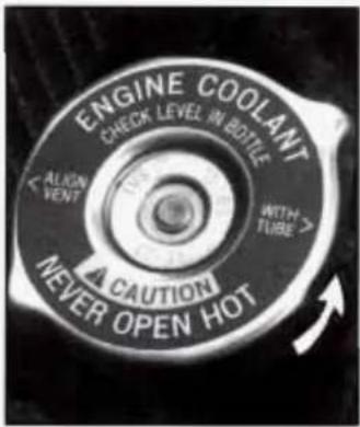ENGINE COOLANT CHECK LEVEL IN BOTTLE ALISSION VENT WITH TUBE > A CAUTION NEVER OPEN HOT