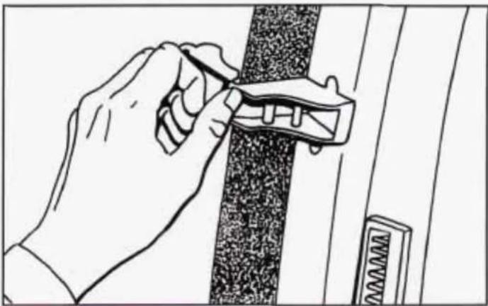 Line drawing of a hand using a tool to adjust or install a component on a textured surface (no text or symbols)