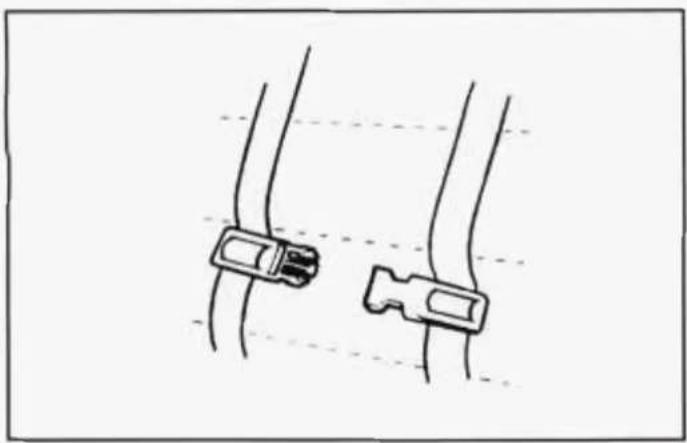 Simple line drawing of two cable connectors with wires, no text or symbols present