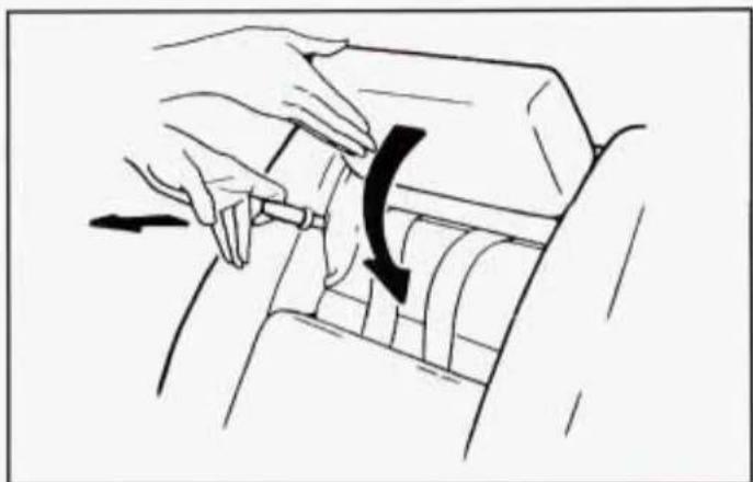 Illustration of hands using a tool to adjust or install a mechanical component, with no visible text or symbols.