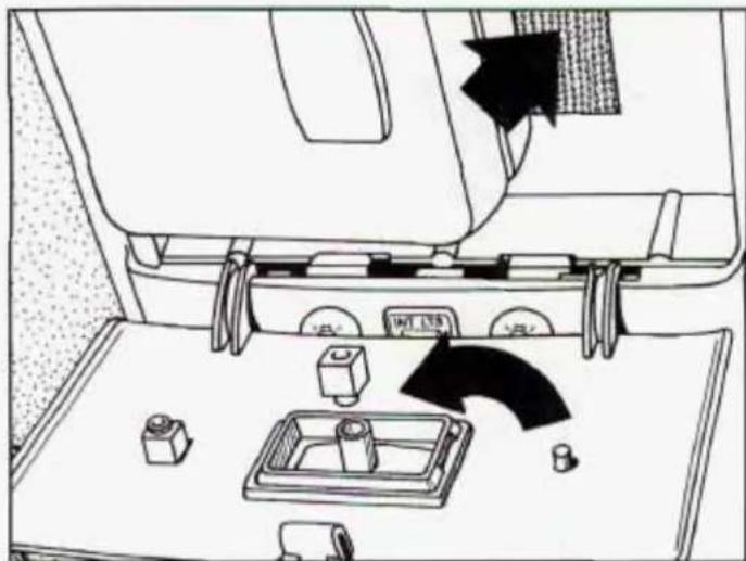 Line drawing of a car interior showing dashboard, control panel, and directional arrow (no text or symbols)