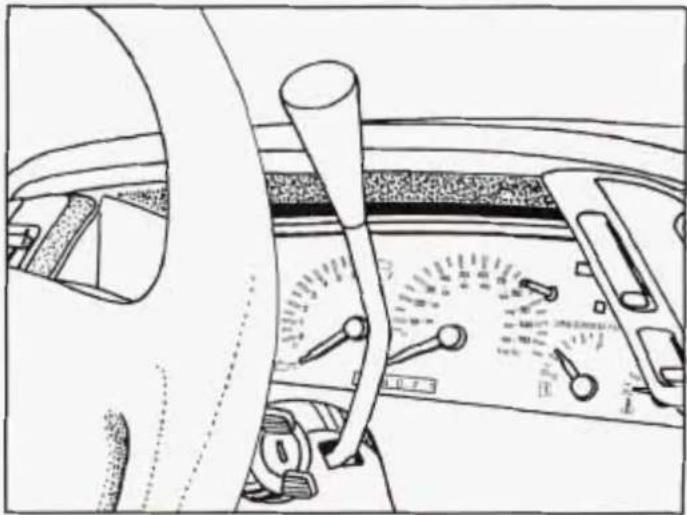 Interior view of a car dashboard with steering wheel and analog dial (no visible text or symbols)