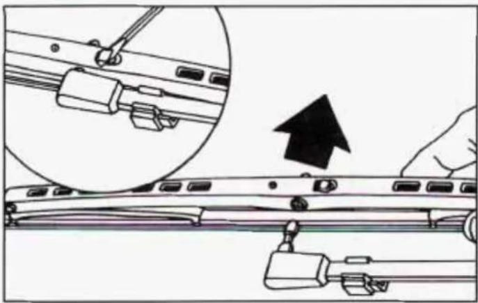 Diagram showing a hand holding a cable connector with an inset close-up of its cable being inserted, no text or symbols present.