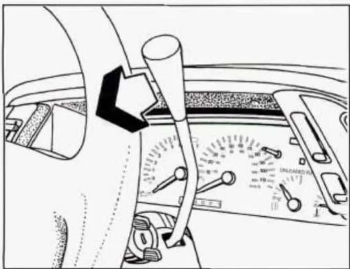Interior view of a car dashboard with steering wheel and analog dial (no visible text or symbols)