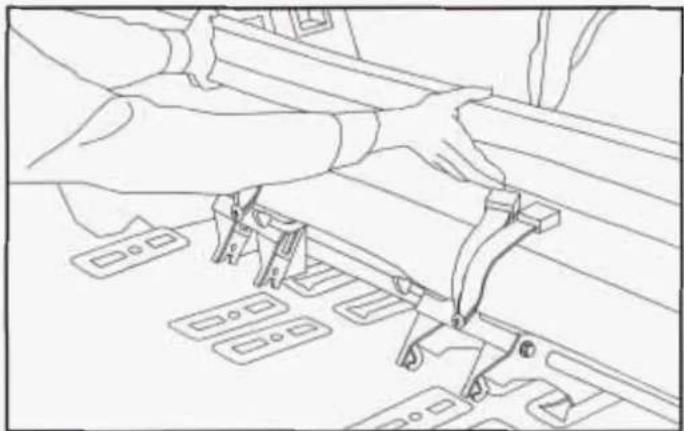 Line drawing of hands installing or adjusting a vehicle's seat frame (no text or symbols)