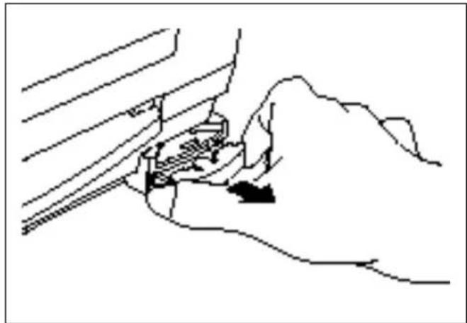Line drawing of a hand pressing down on a mechanical component (no text or symbols)