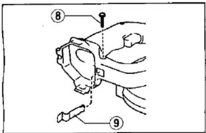 Diagram of a hand holding a wristwatch with labeled parts 8 and 9, showing mechanical assembly or adjustment.