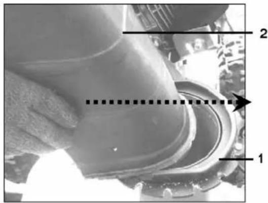 Technical diagram showing a mechanical component with labeled parts 1 and 2, and a dashed line indicating a measurement or alignment.