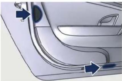 Close-up of a car door handle and side panel with blue arrows indicating direction (no text or symbols)
