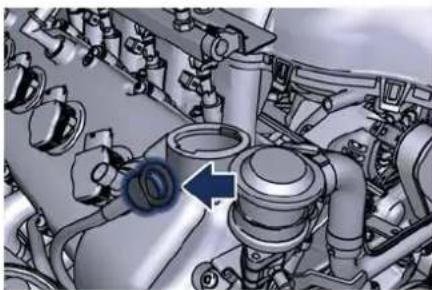 Mechanical assembly diagram showing engine components and a blue arrow indicating a specific part (no text or labels present)