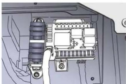 Interior view of an electronic device showing a cable connector and internal components (no text or symbols visible)