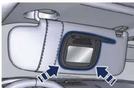 Interior view of a car showing the dashboard and seat area with directional arrows indicating movement (no text or symbols)