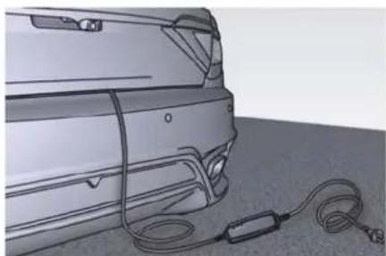 Side view of a car rear bumper with attached cable and connector (no text or symbols visible)