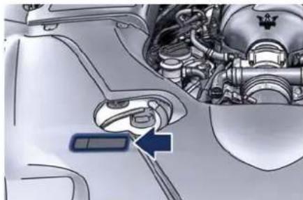 Mechanical assembly diagram showing engine components and a blue arrow pointing to a component (no text or symbols present)