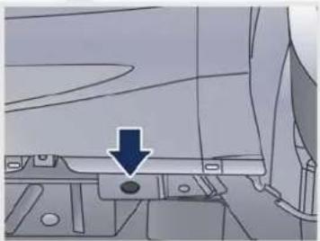 Mechanical component diagram showing a blue arrow pointing to a circular feature on a base (no text or symbols present)