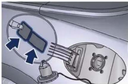 Diagram of a car interior showing a valve, sensor, and motor components with directional arrows indicating flow or movement (no text or symbols present)