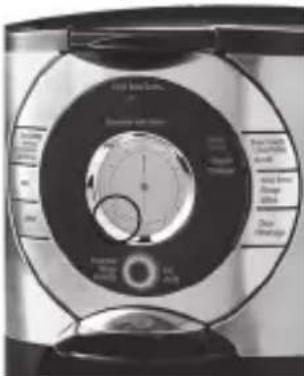Close-up of a circular electronic device with labeled components and a central dial indicator.