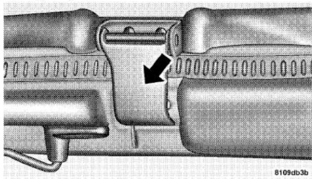 Mechanical assembly diagram showing a pipe fitting with a black arrow indicating a specific component (no text or symbols present)