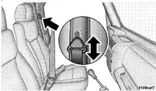 Interior view of a car showing seatbelt buckle and belt buckle assembly (no text or symbols)
