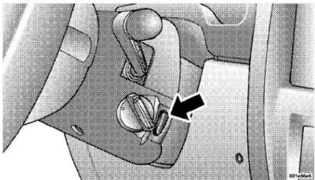 Interior view of a car showing the wheel and seat components with an arrow pointing to a specific part (no text or symbols present)