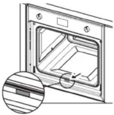 Technical line drawing of an oven with internal compartments and a magnified inset showing wood grain (no text or symbols)