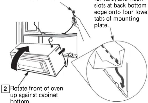 slots at back bottom edge onto four lower tabs of mounting plate. 2 Rotate front of oven up against cabinet bottom.