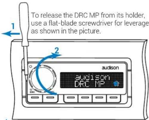 To release the DRC MP from its holder, use a flat-blade screwdriver for leverage as shown in the picture.