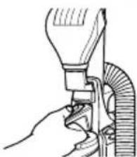 Illustration of a hand using a tool to lift a cylindrical object (no text or symbols visible)