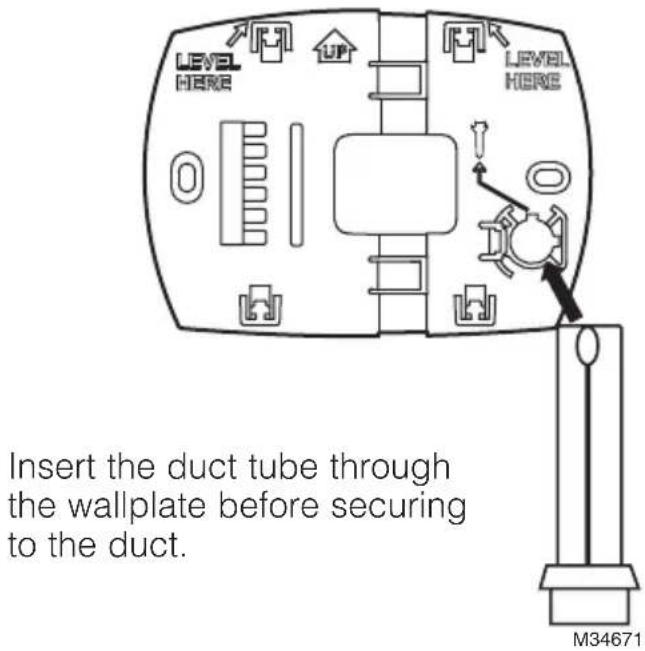 LEVEL HERE UP LEVEL HERE Insert the duct tube through the wallplate before securing to the duct. M34671