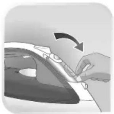Close-up of a hand pressing down on a piece of paper with a curved arrow indicating rotation (no text or symbols)