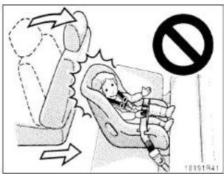 Safety warning illustration showing a child in a car seat with a 'No' symbol indicating no violations.