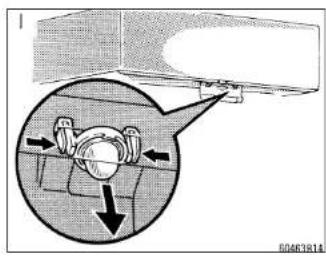 Technical diagram showing mechanical assembly with labeled components and directional arrows, including a magnified inset view.